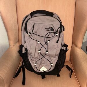 Purple and Black North face backpack